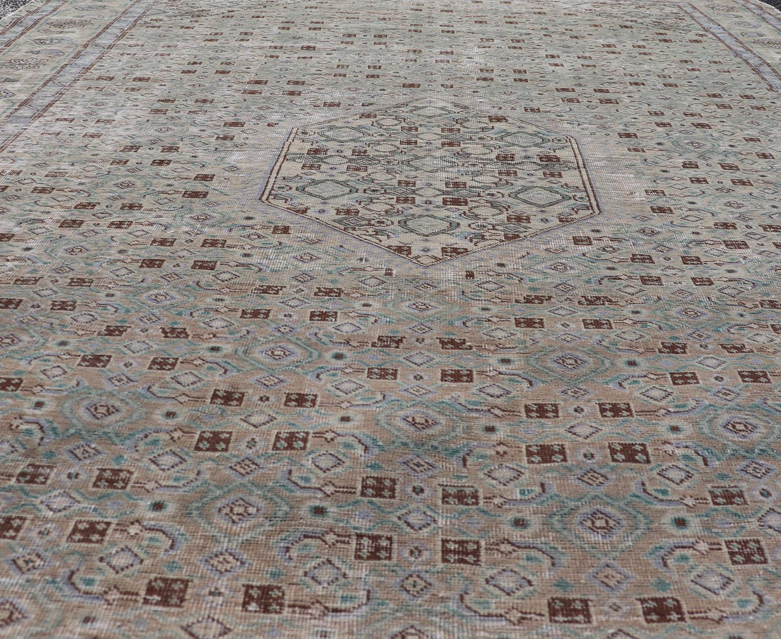 Vintage Persian Tabriz Rug With Floral Medallion in Earthy Tones With Brown. Keivan Woven Arts / rug MSE - 1131, country of origin / type: Iran / Tabriz, circa 1960. Measures: 6'1 x 9'3 This mid - 20th century, handwoven vintage Persian Tabriz rug ... - Keivan Woven ArtsMSE - 1131 - 25594Rug