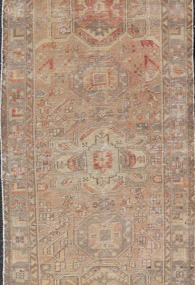 Vintage Persian Heriz by Keivan Woven Arts Distressed Runner in Earthy Tones With Medallion Design. Keivan Woven Arts / rug MSE - 1229, country of origin / type: Iran / Heriz, circa 1960. Measures: 3'4 x 10'4 This vintage Persian Heriz carpet fea... - Keivan Woven ArtsMSE - 1229 - 25539Rug