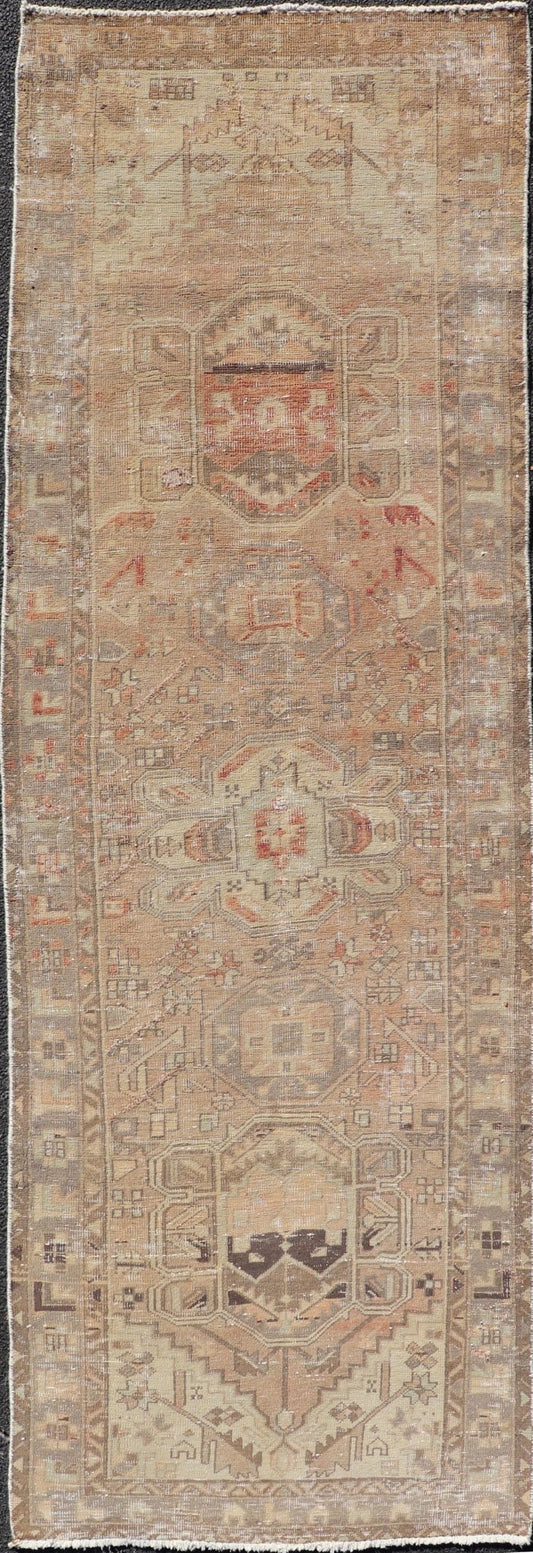 Vintage Persian Heriz by Keivan Woven Arts Distressed Runner in Earthy Tones With Medallion Design. Keivan Woven Arts / rug MSE - 1229, country of origin / type: Iran / Heriz, circa 1960. Measures: 3'4 x 10'4 This vintage Persian Heriz carpet fea... - Keivan Woven ArtsMSE - 1229 - 25539