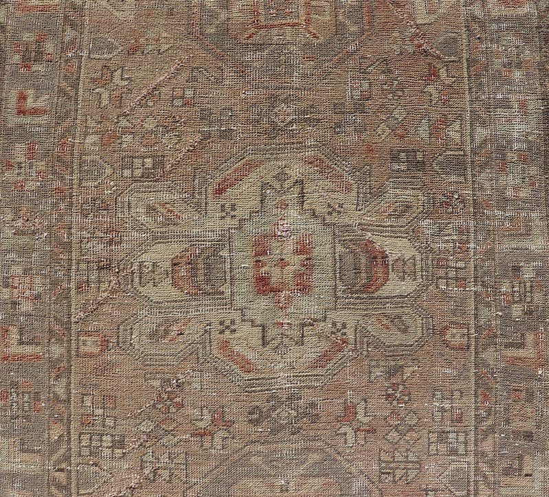 Vintage Persian Heriz by Keivan Woven Arts Distressed Runner in Earthy Tones With Medallion Design. Keivan Woven Arts / rug MSE - 1229, country of origin / type: Iran / Heriz, circa 1960. Measures: 3'4 x 10'4 This vintage Persian Heriz carpet fea... - Keivan Woven ArtsMSE - 1229 - 25539Rug