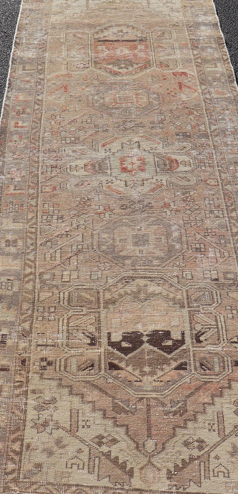 Vintage Persian Heriz by Keivan Woven Arts Distressed Runner in Earthy Tones With Medallion Design. Keivan Woven Arts / rug MSE - 1229, country of origin / type: Iran / Heriz, circa 1960. Measures: 3'4 x 10'4 This vintage Persian Heriz carpet fea... - Keivan Woven ArtsMSE - 1229 - 25539Rug