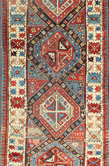 Antique Caucasian Kuba Rug This piece is an impeccable late 19th century Kuba rug with an indigo blue field beneath a geometric vinery trellis featuring bold polychrome medallions and stylized leaves. The ivory frame features repeating turtle mo... - Keivan Woven ArtsN15 - 0308 - 18Rug