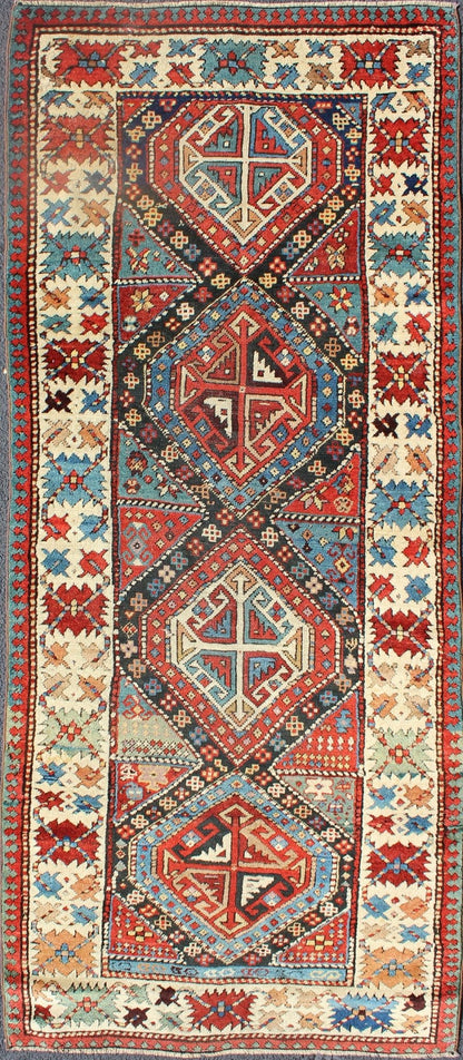 Antique Caucasian Kuba Rug This piece is an impeccable late 19th century Kuba rug with an indigo blue field beneath a geometric vinery trellis featuring bold polychrome medallions and stylized leaves. The ivory frame features repeating turtle mo... - Keivan Woven ArtsN15 - 0308 - 18Rug