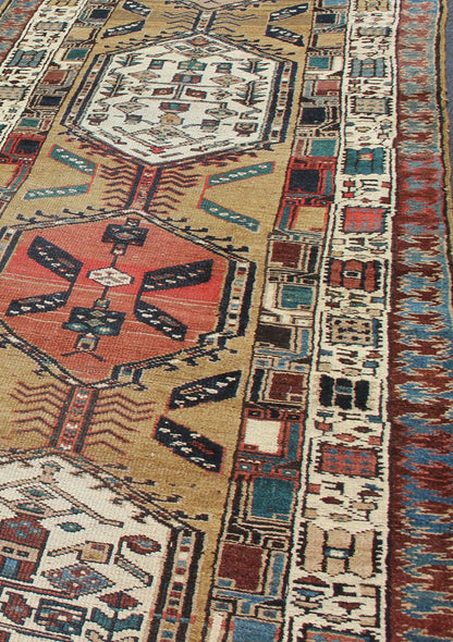 Long Tribal Persian Serab Runner The camel field in this piece is decorated with ivory strap work, navy blue lattice work and stylized Boteh and floral elements. A beautifully drawn Reciprocal Trefoil guard border is complemented by an ivory min... - Keivan Woven ArtsN15 - 0501 - 7695Rug