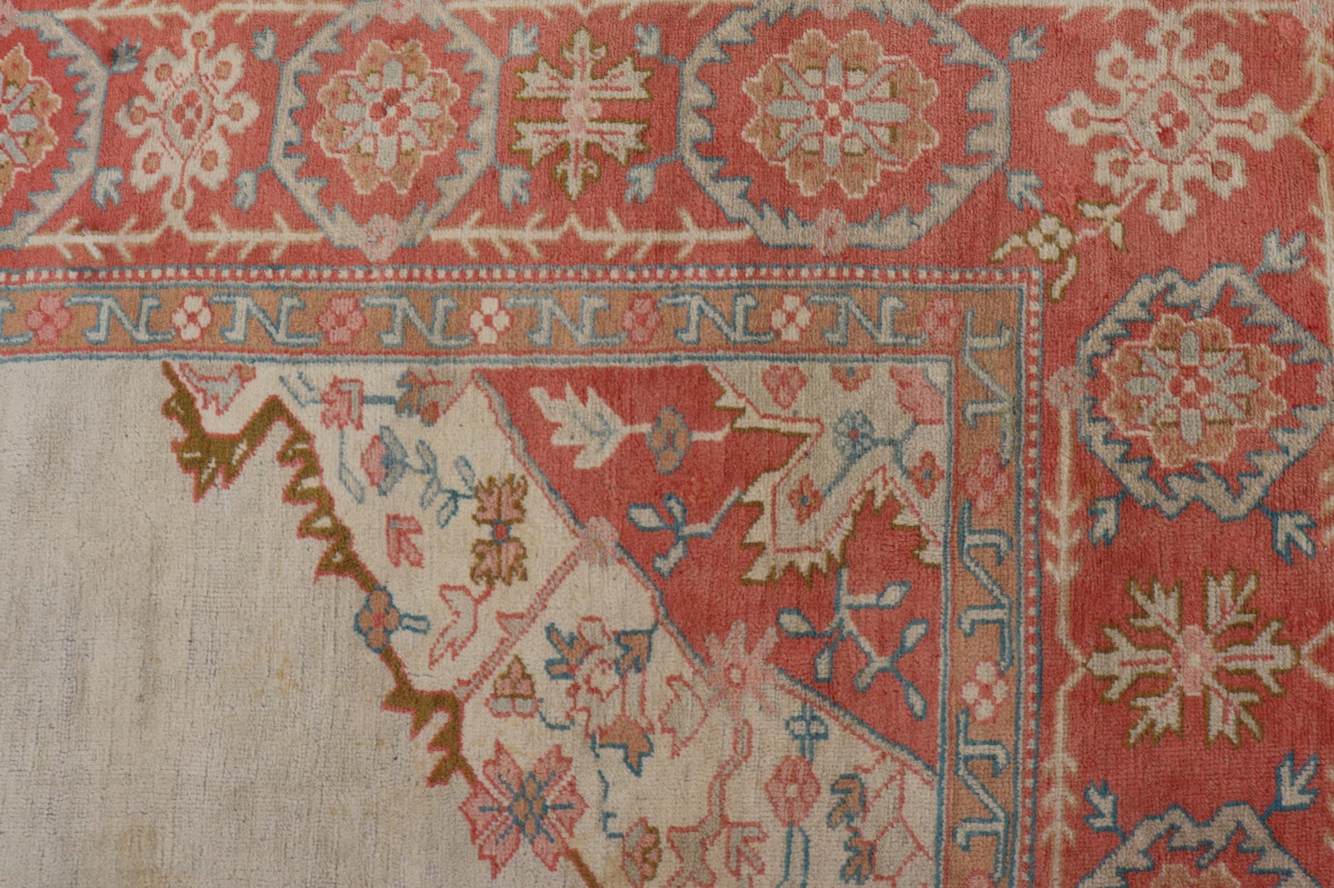Large antique Turkish Oushak rug in light green background and coral border. Keivan Woven Arts / rug N15 - 1002, country of origin / type: Turkey / Oushak, circa Early - 20th century. Measures: 13'4 x 18'. Delicate light sea - foam, taupe and coral imb... - Keivan Woven ArtsN15 - 1002 - 114Rug