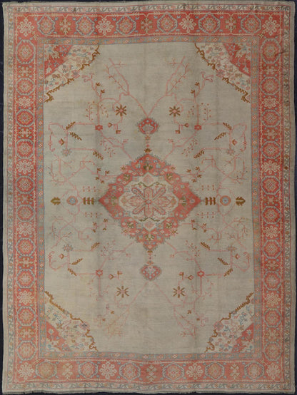 Large antique Turkish Oushak rug in light green background and coral border. Keivan Woven Arts / rug N15 - 1002, country of origin / type: Turkey / Oushak, circa Early - 20th century. Measures: 13'4 x 18'. Delicate light sea - foam, taupe and coral imb... - Keivan Woven ArtsN15 - 1002 - 114Rug