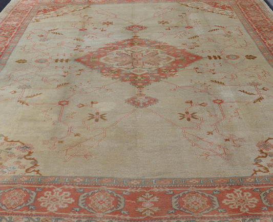 Large antique Turkish Oushak rug in light green background and coral border. Keivan Woven Arts / rug N15 - 1002, country of origin / type: Turkey / Oushak, circa Early - 20th century. Measures: 13'4 x 18'. Delicate light sea - foam, taupe and coral imb... - Keivan Woven ArtsN15 - 1002 - 114Rug