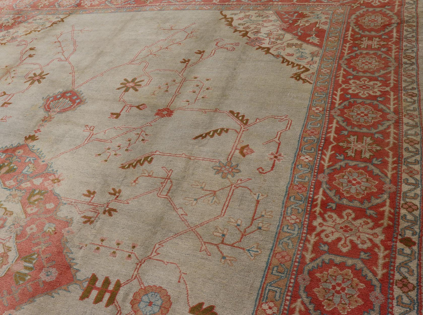 Large antique Turkish Oushak rug in light green background and coral border. Keivan Woven Arts / rug N15 - 1002, country of origin / type: Turkey / Oushak, circa Early - 20th century. Measures: 13'4 x 18'. Delicate light sea - foam, taupe and coral imb... - Keivan Woven ArtsN15 - 1002 - 114Rug