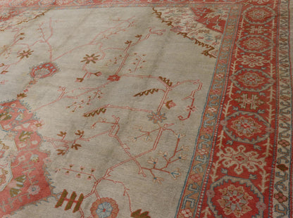 Large antique Turkish Oushak rug in light green background and coral border. Keivan Woven Arts / rug N15 - 1002, country of origin / type: Turkey / Oushak, circa Early - 20th century. Measures: 13'4 x 18'. Delicate light sea - foam, taupe and coral imb... - Keivan Woven ArtsN15 - 1002 - 114Rug