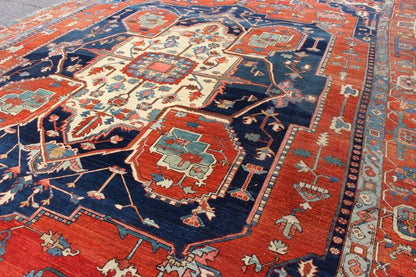 Antique Persian fine weave Serapi rug with large geometric medallion in brilliant colors and blue and tomato red. Keivan Woven Arts / Rug / N15 - 1204 / country of origin / type: Iran /Serapi, circa 1900. Measures: 10.3 x 14.4. Antique Serapi rugs... - Keivan Woven ArtsN15 - 1204 - 7889Rug
