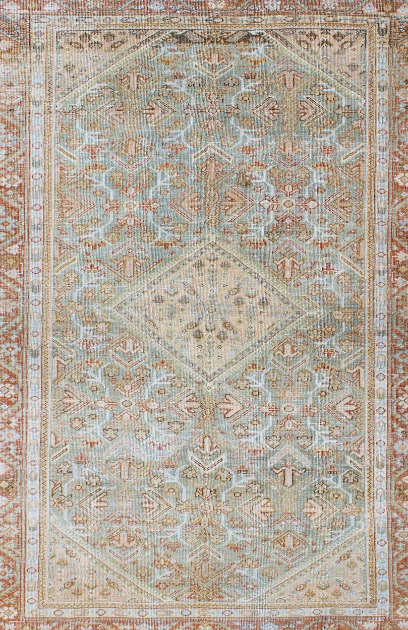 Persian Mahal antique rug with floral design in Peach, green, blue, and red colors with central Medallion, rug na - 180709, country of origin / type: Iran / Mahal, circa 1920. This antique Persian Mahal rug, circa early 20th century, relies heavil... - Keivan Woven ArtsNA - 180709 - 10512Rug