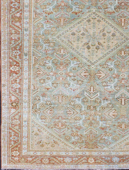 Persian Mahal antique rug with floral design in Peach, green, blue, and red colors with central Medallion, rug na - 180709, country of origin / type: Iran / Mahal, circa 1920. This antique Persian Mahal rug, circa early 20th century, relies heavil... - Keivan Woven ArtsNA - 180709 - 10512Rug