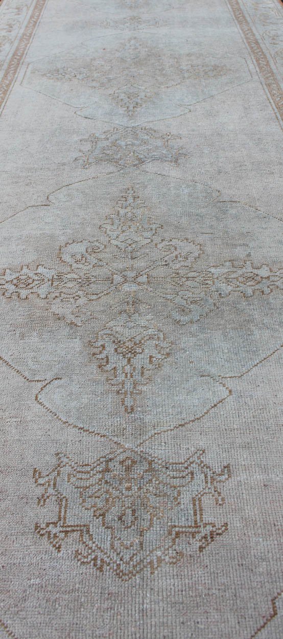 Vintage Turkish Oushak gallery runner with medallions in muted tones, rug na - 54280, country of origin / type: Turkey / Oushak, circa mid - 20th century This beautiful vintage Oushak runner from mid - 20th century Turkey features a classic Oushak des... - Keivan Woven ArtsNA - 54280 - 1400Rug