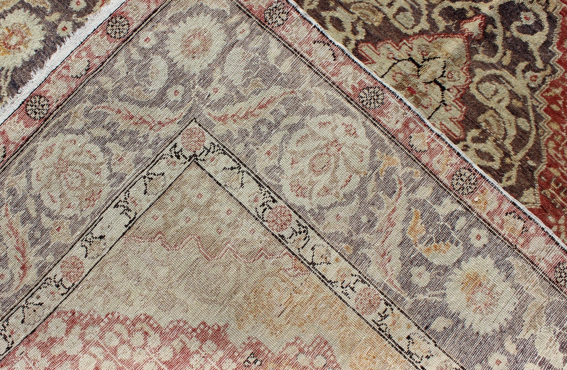 Antique Turkish Oushak Rug with Floral Medallion Design in Red and Charcoal Measures: 4'4 x 7'2 This antique Turkish Oushak carpet features a central medallion design, as well as patterns of smaller floral shapes and botanical elements ... - Keivan Woven ArtsNA - 54563 - 1066Rug