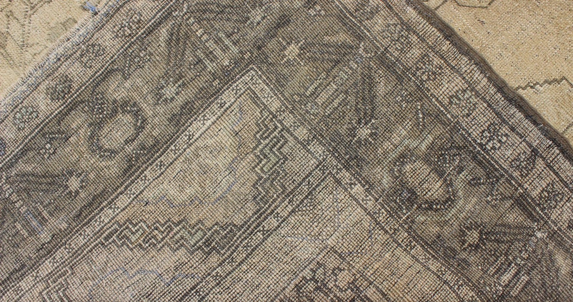 Antique Turkish Oushak with Stylized Medallion Design in Muted Neutral Tones This beautifully muted antique Turkish Oushak displays a stretched central medallion filled with Sub - geometric floral motifs and capped with palmettes. The saw - toothed ... - Keivan Woven ArtsNA - 54726 - 1582Rug