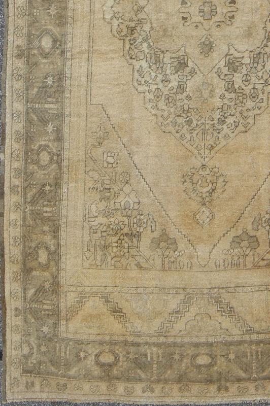 Antique Turkish Oushak with Stylized Medallion Design in Muted Neutral Tones This beautifully muted antique Turkish Oushak displays a stretched central medallion filled with Sub - geometric floral motifs and capped with palmettes. The saw - toothed ... - Keivan Woven ArtsNA - 54726 - 1582Rug