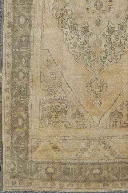 Antique Turkish Oushak with Stylized Medallion Design in Muted Neutral Tones This beautifully muted antique Turkish Oushak displays a stretched central medallion filled with Sub - geometric floral motifs and capped with palmettes. The saw - toothed ... - Keivan Woven ArtsNA - 54726 - 1582Rug