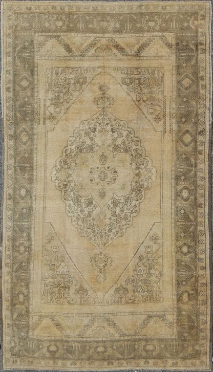 Antique Turkish Oushak with Stylized Medallion Design in Muted Neutral Tones This beautifully muted antique Turkish Oushak displays a stretched central medallion filled with Sub - geometric floral motifs and capped with palmettes. The saw - toothed ... - Keivan Woven ArtsNA - 54726 - 1582Rug