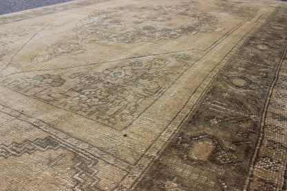 Antique Turkish Oushak with Stylized Medallion Design in Muted Neutral Tones This beautifully muted antique Turkish Oushak displays a stretched central medallion filled with Sub - geometric floral motifs and capped with palmettes. The saw - toothed ... - Keivan Woven ArtsNA - 54726 - 1582Rug