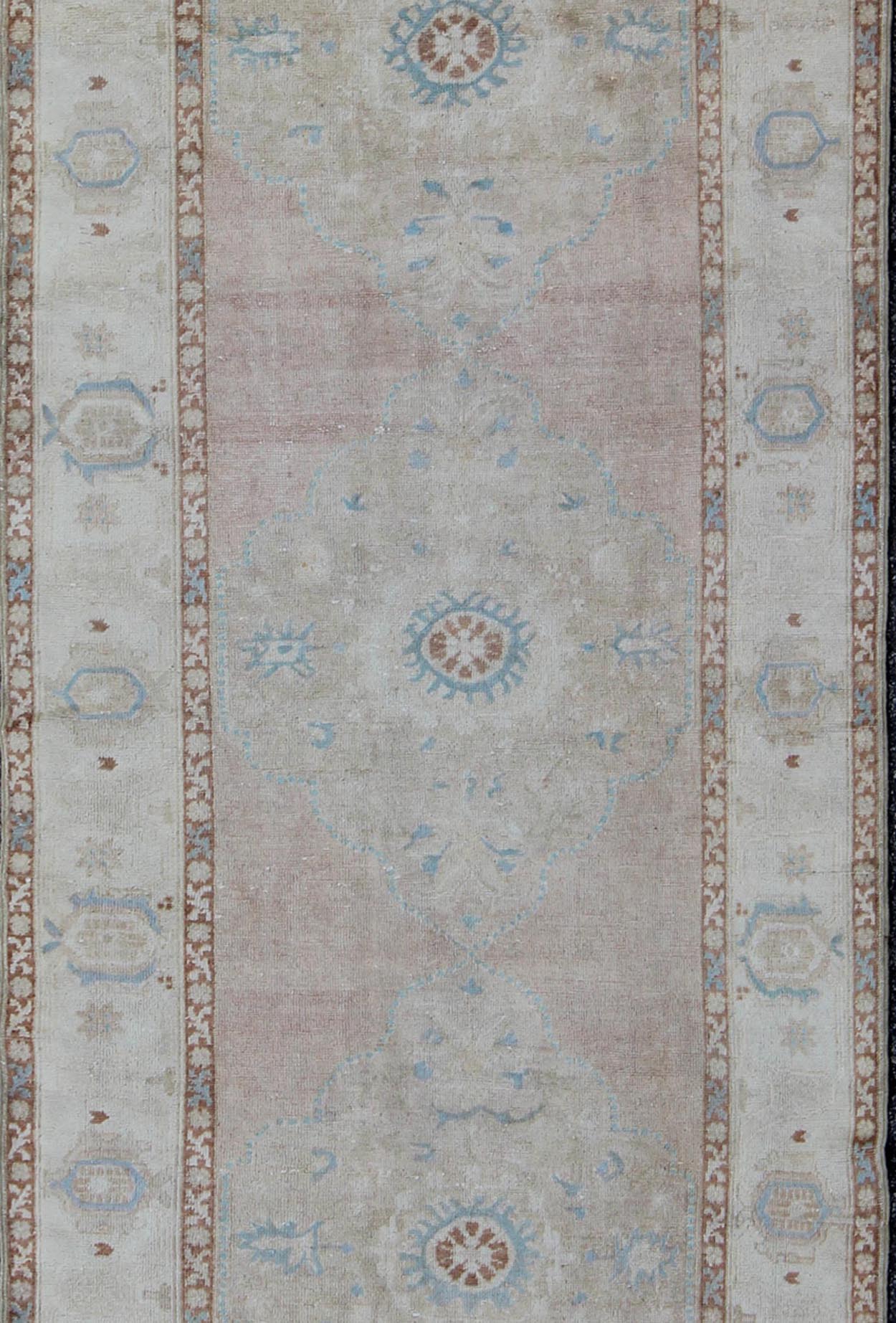 Pale pink, teal and ivory vintage Turkish Oushak runner with three medallions, rug na - 63085, country of origin / type: Turkey / Oushak, circa 1930 This beautiful vintage Oushak runner from early 20th century Turkey features a classic Oushak desi... - Keivan Woven ArtsNA - 63085 - 1428Rug