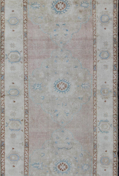 Pale pink, teal and ivory vintage Turkish Oushak runner with three medallions, rug na - 63085, country of origin / type: Turkey / Oushak, circa 1930 This beautiful vintage Oushak runner from early 20th century Turkey features a classic Oushak desi... - Keivan Woven ArtsNA - 63085 - 1428Rug