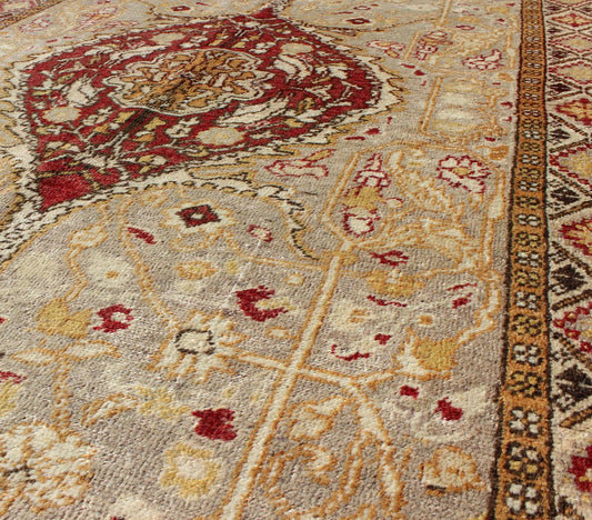 Vintage Turkish Medallion Oushak Area Rug in Red, Taupe, Gold, and Cocoa Measures: 4 x 6'8 This vintage Turkish Oushak carpet (circa mid - 20th century) features a central medallion design, as well as patterns of smaller floral shapes and b... - Keivan Woven ArtsNA - 63769 - 2131Rug