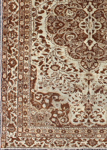 Measures: 5'1 x 7'3 This century - old Sivas displays an ivory field surrounded by a richly detailed classical arabesque design, with an intricate center medallion in the field that animates the tone and plays off of the finely detailed texture ... - Keivan Woven ArtsNA - 63818 - 1036Rug