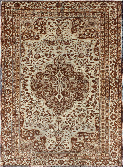 Measures: 5'1 x 7'3 This century - old Sivas displays an ivory field surrounded by a richly detailed classical arabesque design, with an intricate center medallion in the field that animates the tone and plays off of the finely detailed texture ... - Keivan Woven ArtsNA - 63818 - 1036Rug