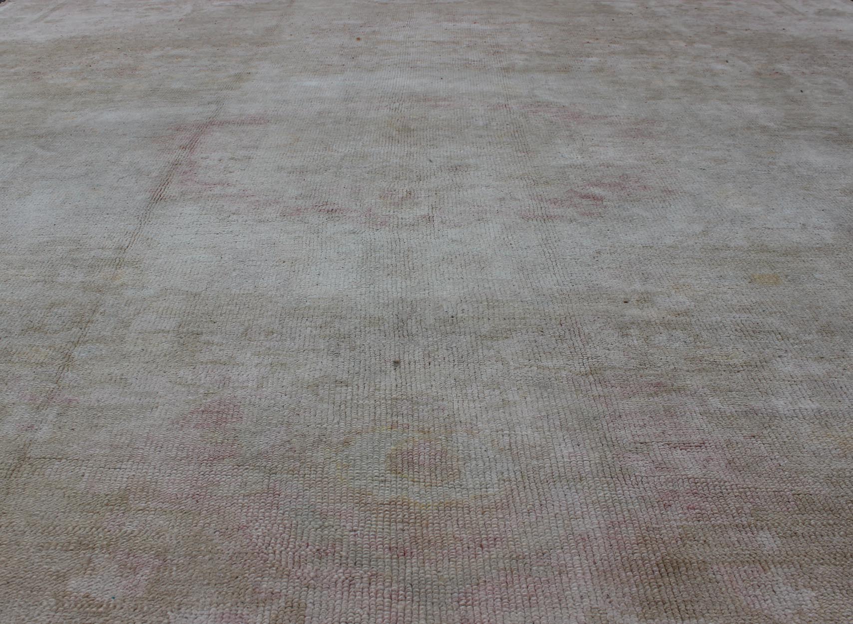 Antique Turkish Konya Area Rug in Gray & Soft Pink with Subtle Design Measures: 7.3 x 8.8 This intricate antique Turkish Konya carpet features a muted color palette of taupe, light gray, and ash pink, with a beautiful botanical central m... - Keivan Woven ArtsNA - 75054 - 794Rug
