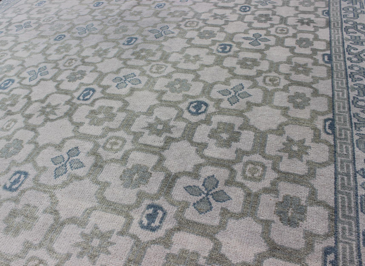 Modern Hand - Knotted Khotan Rug in Wool with All - Over Sub - Geometric Design by Keivan Woven Arts This modern Khotan rug has been hand - knotted in wool and features an all - over sub - geometric design rendered in blue, green and cream tones. A complem... - Keivan Woven ArtsOB - 103140415 - 1100057 - 9693Rug