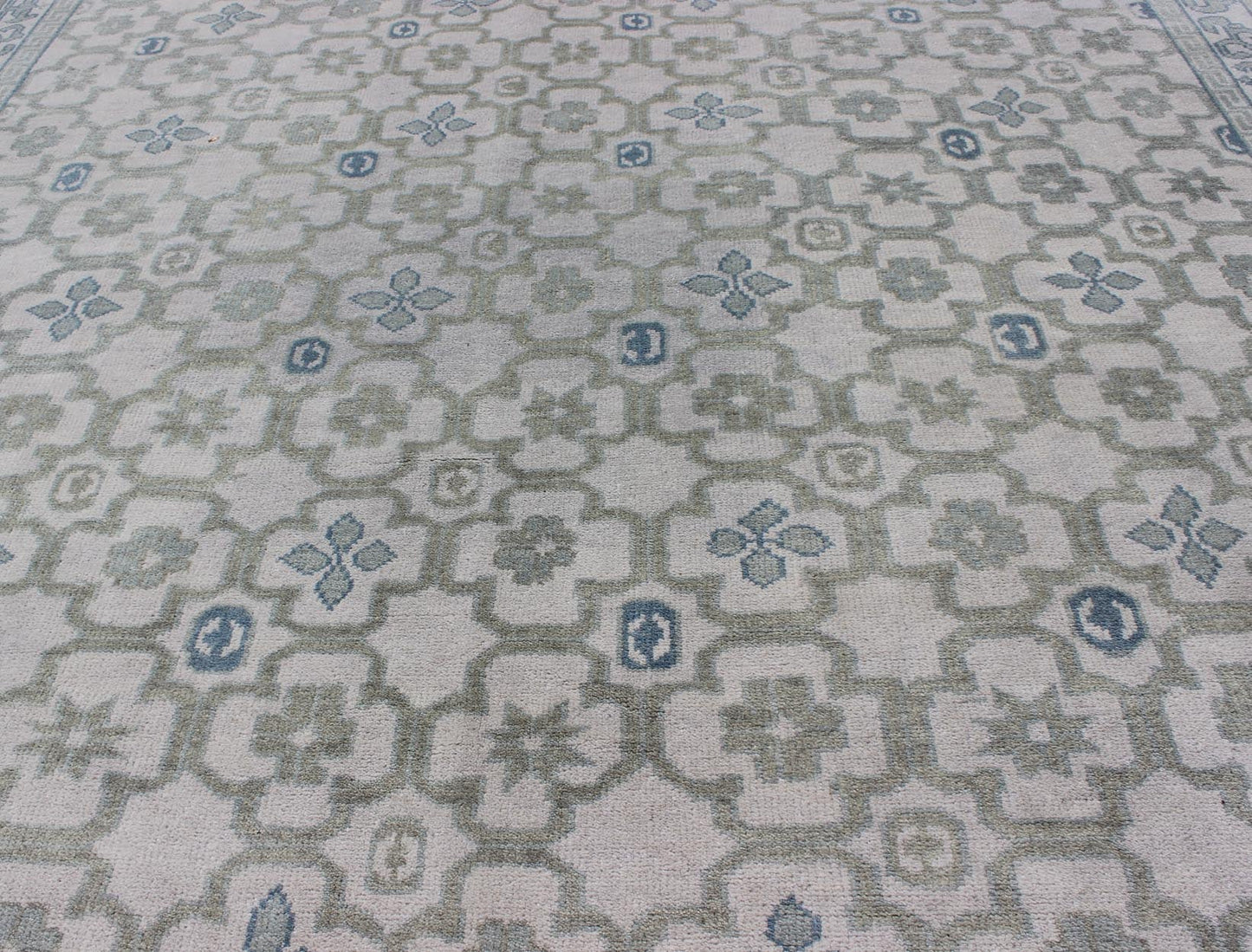 Modern Hand - Knotted Khotan Rug in Wool with All - Over Sub - Geometric Design by Keivan Woven Arts This modern Khotan rug has been hand - knotted in wool and features an all - over sub - geometric design rendered in blue, green and cream tones. A complem... - Keivan Woven ArtsOB - 103140415 - 1100057 - 9693Rug