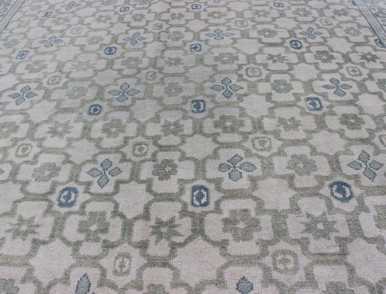 Modern Hand - Knotted Khotan Rug in Wool with All - Over Sub - Geometric Design by Keivan Woven Arts This modern Khotan rug has been hand - knotted in wool and features an all - over sub - geometric design rendered in blue, green and cream tones. A complem... - Keivan Woven ArtsOB - 103140415 - 1100057 - 9693Rug