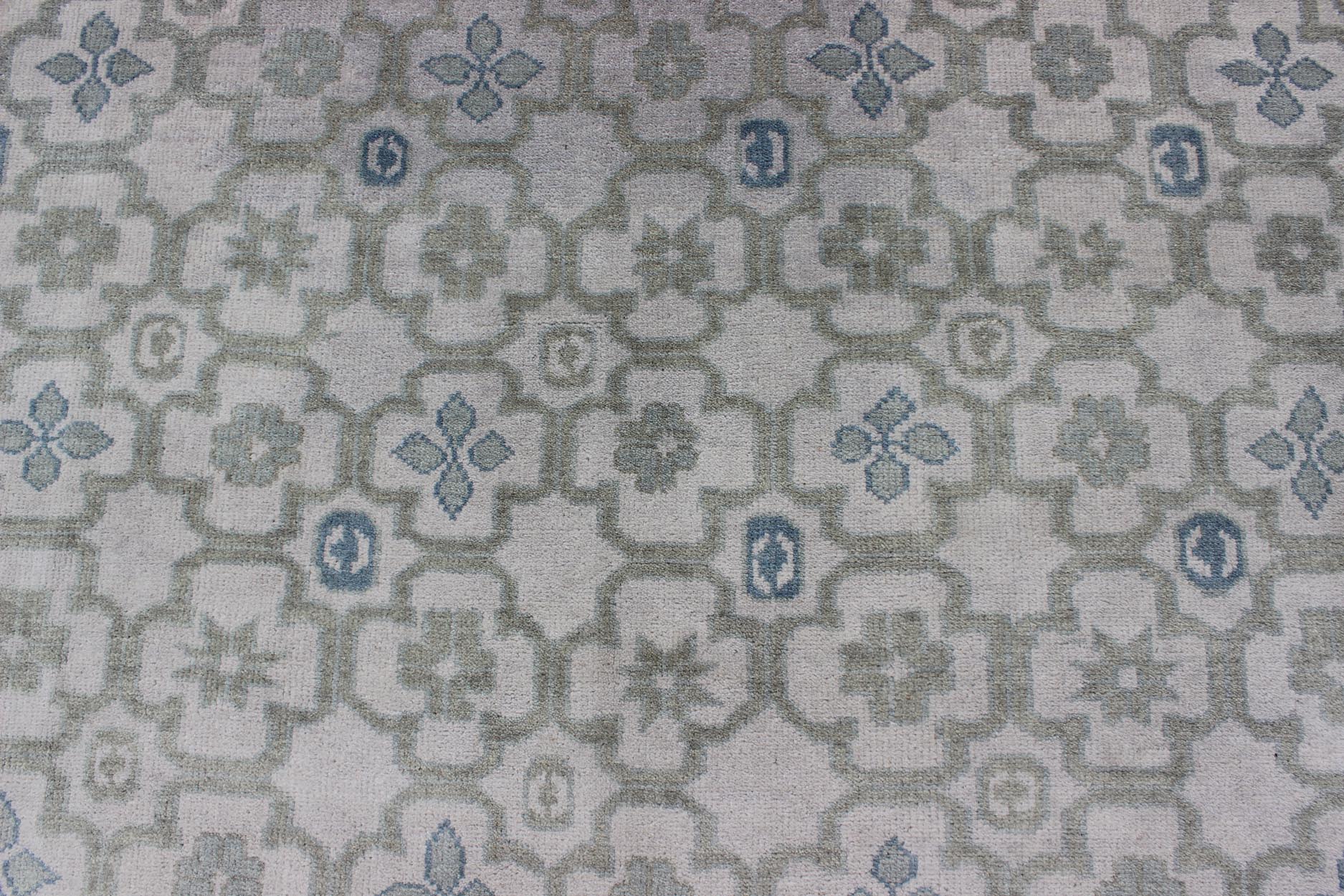 Modern Hand - Knotted Khotan Rug in Wool with All - Over Sub - Geometric Design by Keivan Woven Arts This modern Khotan rug has been hand - knotted in wool and features an all - over sub - geometric design rendered in blue, green and cream tones. A complem... - Keivan Woven ArtsOB - 103140415 - 1100057 - 9693Rug