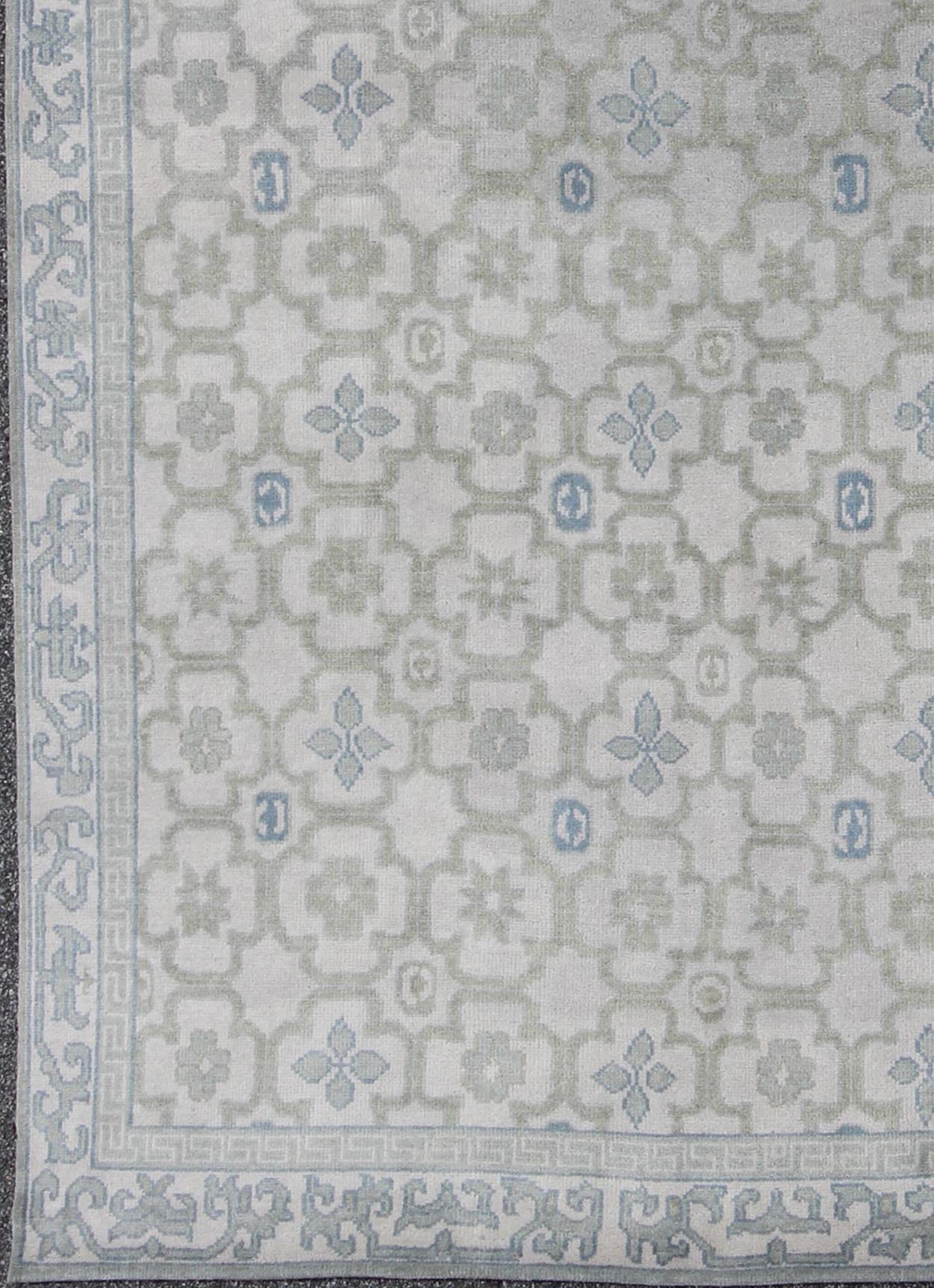 Modern Hand - Knotted Khotan Rug in Wool with All - Over Sub - Geometric Design by Keivan Woven Arts This modern Khotan rug has been hand - knotted in wool and features an all - over sub - geometric design rendered in blue, green and cream tones. A complem... - Keivan Woven ArtsOB - 103140415 - 1100057 - 9693Rug