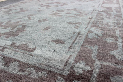 Indian Hand - Knotted Floral Oushak Rug in Muted Blue and Cocoa Measures 5'6 x 8'6 This floral Oushak rug was hand - knotted with Indian wool during the 2010's. The background of the center field is rendered in a beautiful muted blue, with f... - Keivan Woven ArtsOB - 103432967 - 0623026 - 6987Rug