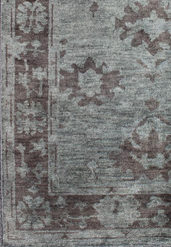 Indian Hand - Knotted Floral Oushak Rug in Muted Blue and Cocoa Measures 5'6 x 8'6 This floral Oushak rug was hand - knotted with Indian wool during the 2010's. The background of the center field is rendered in a beautiful muted blue, with f... - Keivan Woven ArtsOB - 103432967 - 0623026 - 6987Rug
