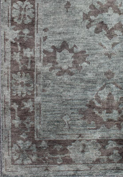 Indian Hand - Knotted Floral Oushak Rug in Muted Blue and Cocoa Measures 5'6 x 8'6 This floral Oushak rug was hand - knotted with Indian wool during the 2010's. The background of the center field is rendered in a beautiful muted blue, with f... - Keivan Woven ArtsOB - 103432967 - 0623026 - 6987Rug