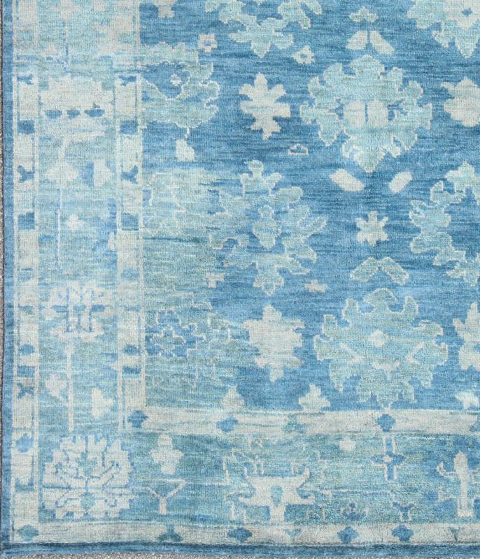 Hand - Knotted Modern Oushak Rug in Wool with Sub - Geometric Floral Design in Blue Tones This modern Indian Oushak rug has been hand - knotted in wool and features an all - over, sub - geometric floral design rendered in blue tones. A complementary, mult... - Keivan Woven ArtsOB - 103433912 - 0623023 - 7549Rug