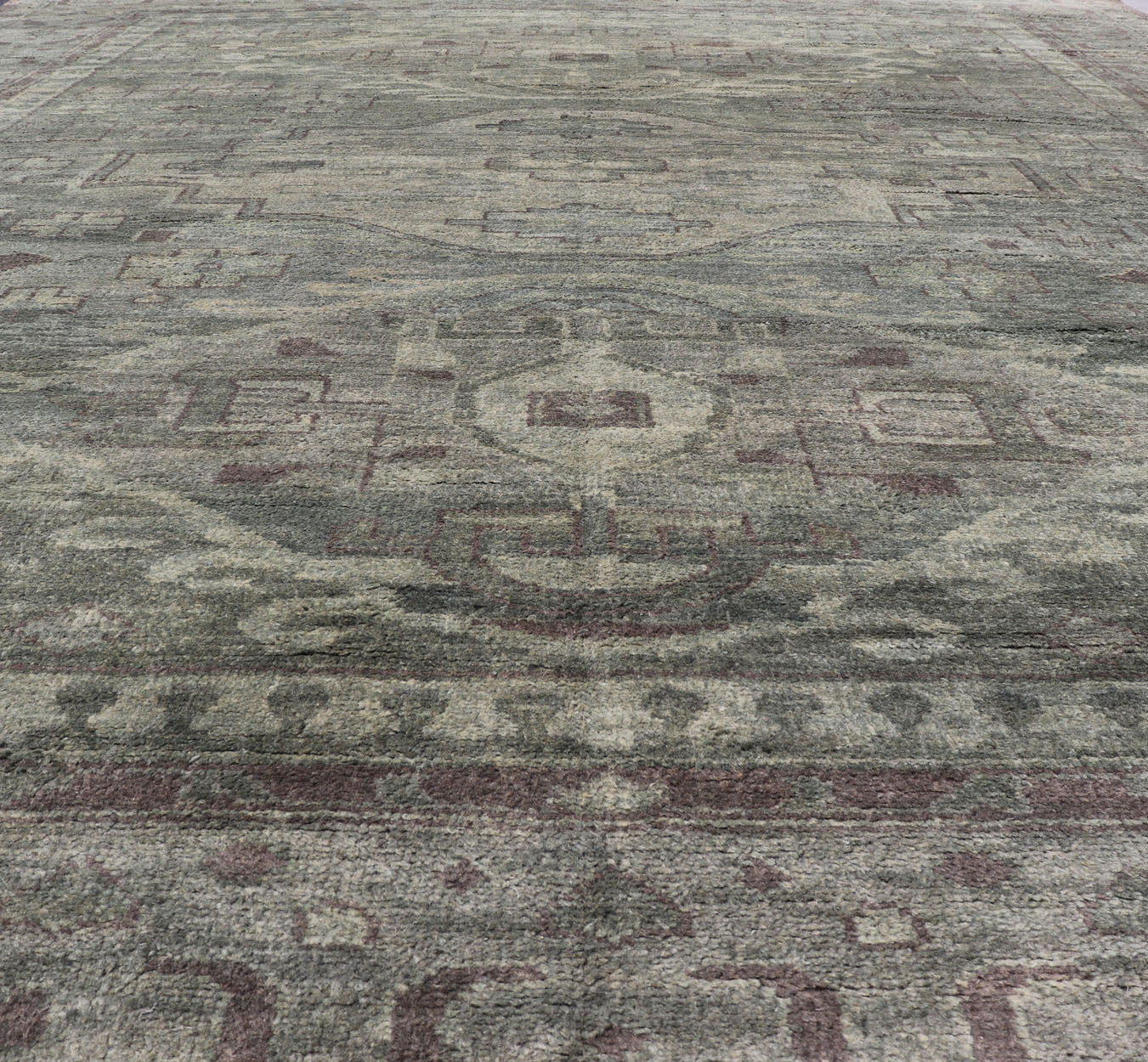 Large Modern Tribal Medallion Khotan in Muted Earthy Green Colors Measures 12'0 x 15'0 The border has tribal markings in a rich green brown color, atop a rustic blend of forest green background. The field remains the same forest green c... - Keivan Woven ArtsOB - 103434781 - 6230017 - 21084Rug