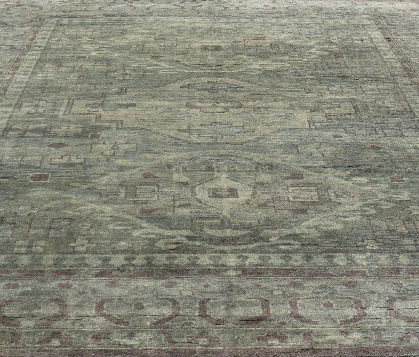 Large Modern Tribal Medallion Khotan in Muted Earthy Green Colors Measures 12'0 x 15'0 The border has tribal markings in a rich green brown color, atop a rustic blend of forest green background. The field remains the same forest green c... - Keivan Woven ArtsOB - 103434781 - 6230017 - 21084Rug
