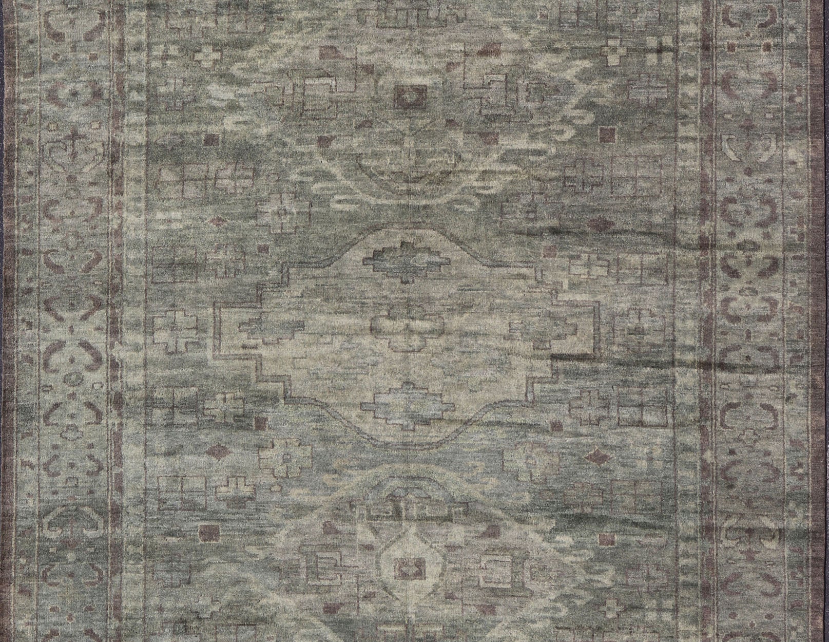 Large Modern Tribal Medallion Khotan in Muted Earthy Green Colors Measures 12'0 x 15'0 The border has tribal markings in a rich green brown color, atop a rustic blend of forest green background. The field remains the same forest green c... - Keivan Woven ArtsOB - 103434781 - 6230017 - 21084Rug