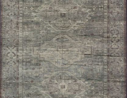 Large Modern Tribal Medallion Khotan in Muted Earthy Green Colors Measures 12'0 x 15'0 The border has tribal markings in a rich green brown color, atop a rustic blend of forest green background. The field remains the same forest green c... - Keivan Woven ArtsOB - 103434781 - 6230017 - 21084Rug