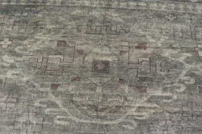 Large Modern Tribal Medallion Khotan in Muted Earthy Green Colors Measures 12'0 x 15'0 The border has tribal markings in a rich green brown color, atop a rustic blend of forest green background. The field remains the same forest green c... - Keivan Woven ArtsOB - 103434781 - 6230017 - 21084Rug