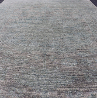 Modern Muted Oushak Type Rug in Wool With Sub - Geometric Design in Green & Earthy Tones This modern Indian rug has been hand - knotted in wool and features an all - over, sub - geometric design rendered in green and earthy tones. A complementary, mult... - Keivan Woven ArtsOB - 104744922 - 56230141 - 15512