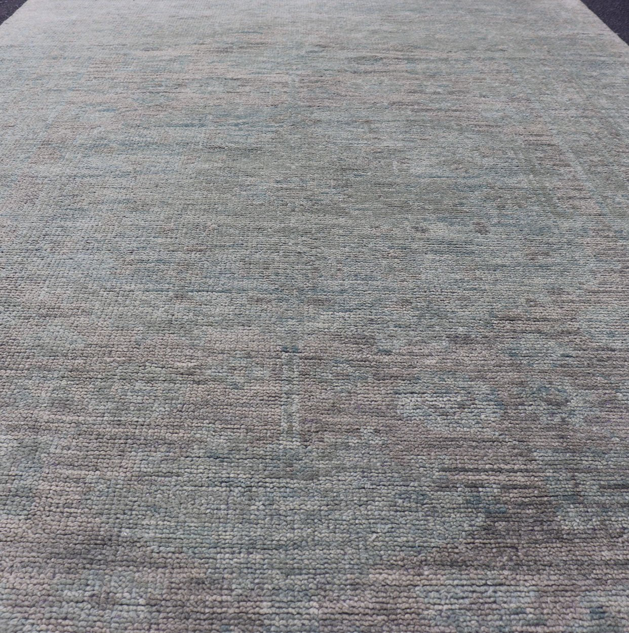 Modern Muted Oushak Type Rug in Wool With Sub - Geometric Design in Green & Earthy Tones This modern Indian rug has been hand - knotted in wool and features an all - over, sub - geometric design rendered in green and earthy tones. A complementary, mult... - Keivan Woven ArtsOB - 104744922 - 56230141 - 15512Rug