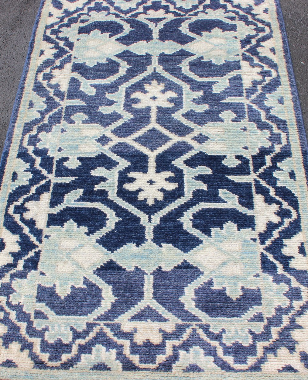 Modern Hand - Knotted Oushak Rug in Wool with Sub - Geometric Design in Blue This modern Indian Oushak rug has been hand - knotted in wool and features an all - over, sub - geometric design rendered in blue and ivory tones. A complementary, multi - tiered ... - Keivan Woven ArtsOB - 10542973 - 6230320 - 11311Rug