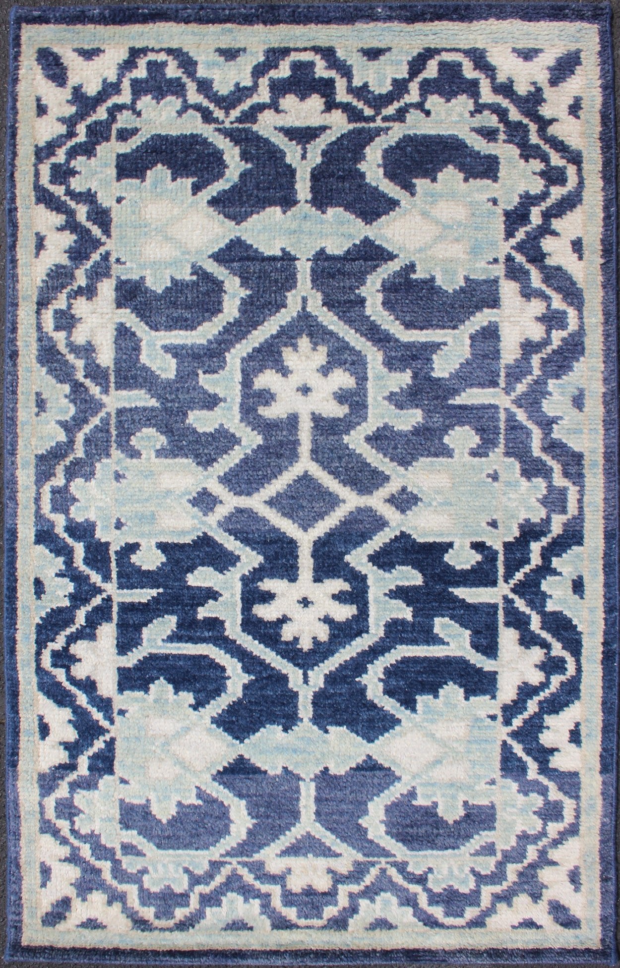 Modern Hand - Knotted Oushak Rug in Wool with Sub - Geometric Design in Blue This modern Indian Oushak rug has been hand - knotted in wool and features an all - over, sub - geometric design rendered in blue and ivory tones. A complementary, multi - tiered ... - Keivan Woven ArtsOB - 10542973 - 6230320 - 11311Rug