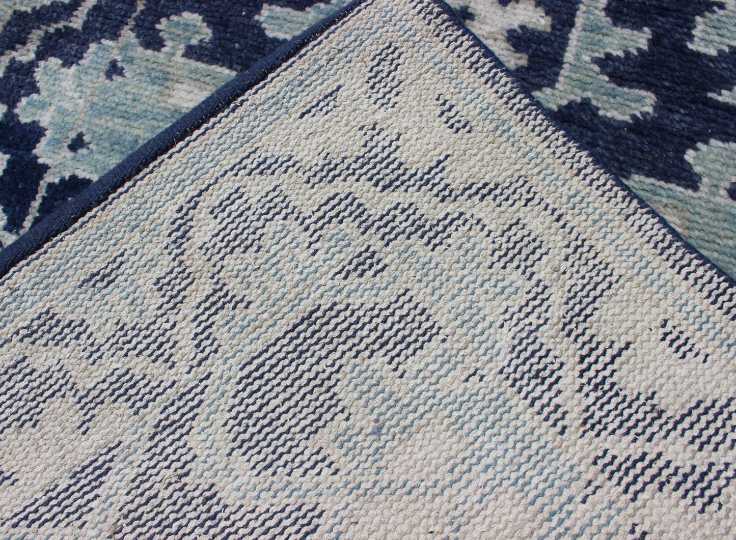 Modern Hand - Knotted Oushak Rug in Wool with Sub - Geometric Design in Blue This modern Indian Oushak rug has been hand - knotted in wool and features an all - over, sub - geometric design rendered in blue and ivory tones. A complementary, multi - tiered ... - Keivan Woven ArtsOB - 10542973 - 6230320 - 11311Rug