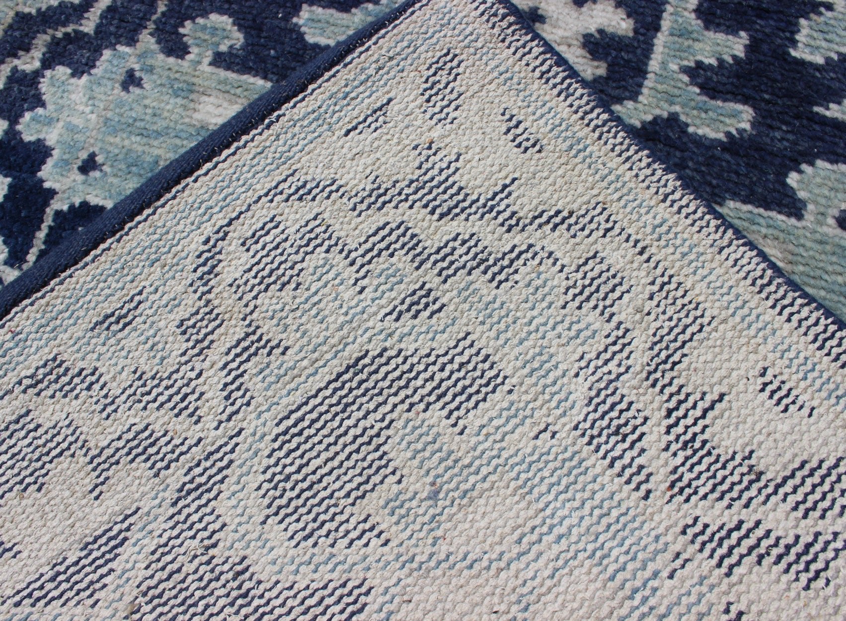 Modern Hand - Knotted Oushak Rug in Wool with Sub - Geometric Design in Blue This modern Indian Oushak rug has been hand - knotted in wool and features an all - over, sub - geometric design rendered in blue and ivory tones. A complementary, multi - tiered ... - Keivan Woven ArtsOB - 10542973 - 6230320 - 11311Rug