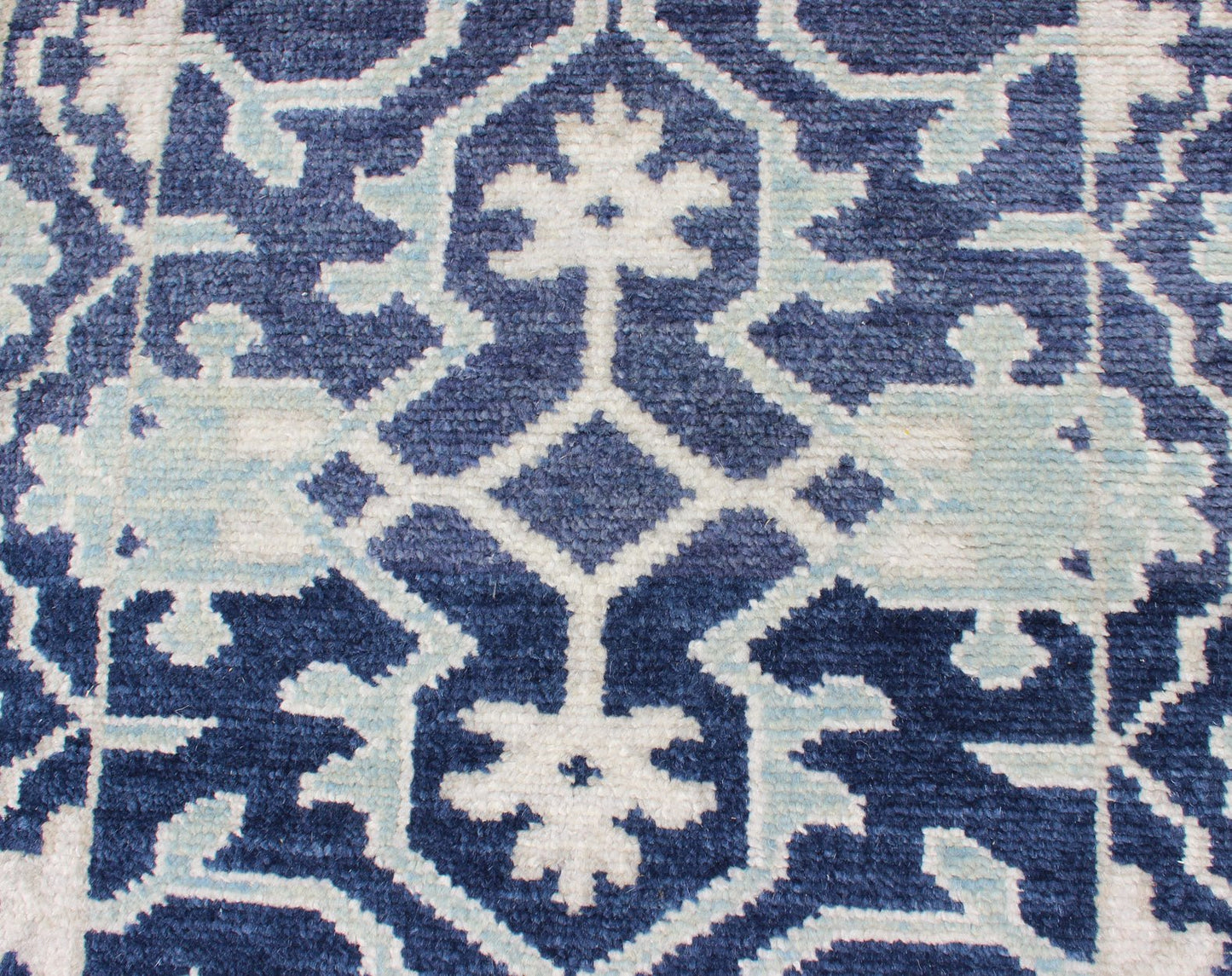 Modern Hand - Knotted Oushak Rug in Wool with Sub - Geometric Design in Blue This modern Indian Oushak rug has been hand - knotted in wool and features an all - over, sub - geometric design rendered in blue and ivory tones. A complementary, multi - tiered ... - Keivan Woven ArtsOB - 10542973 - 6230320 - 11311Rug